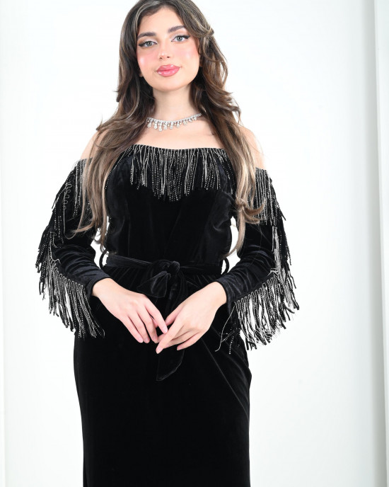 Women's evening dress decorated with a silver fringe
