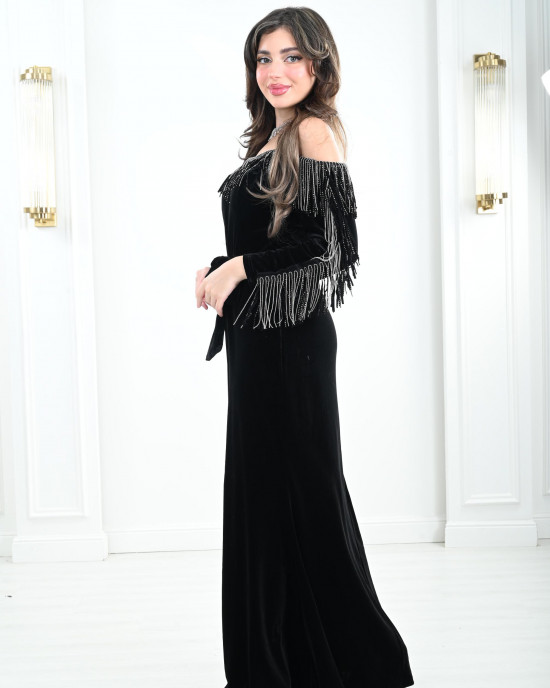 Women's evening dress decorated with a silver fringe