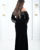 Women's evening dress decorated with a silver fringe