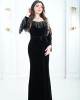 Women's evening dress decorated with a silver fringe